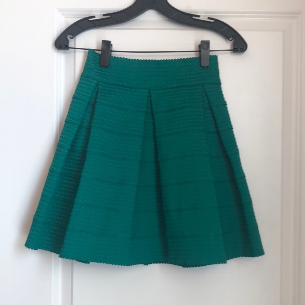 Green pleated skirt